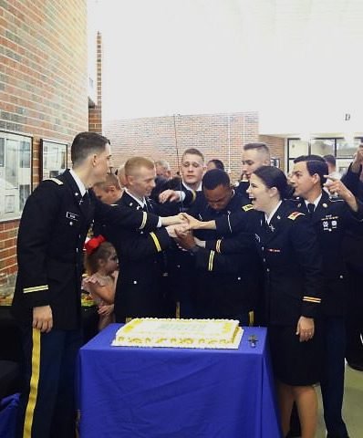 Demons Regiment cutting a cake.